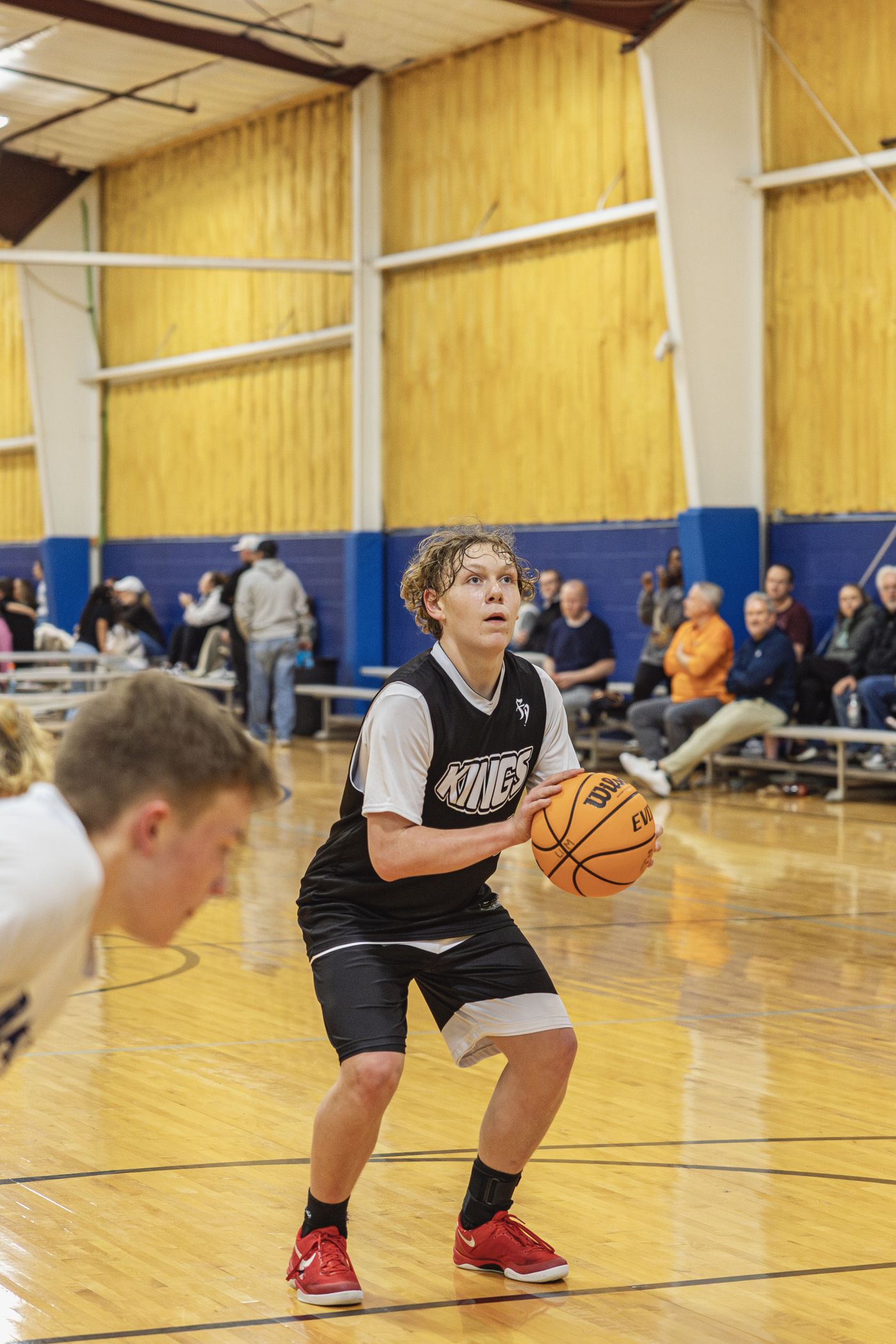 Kings player handling the ball on the court.