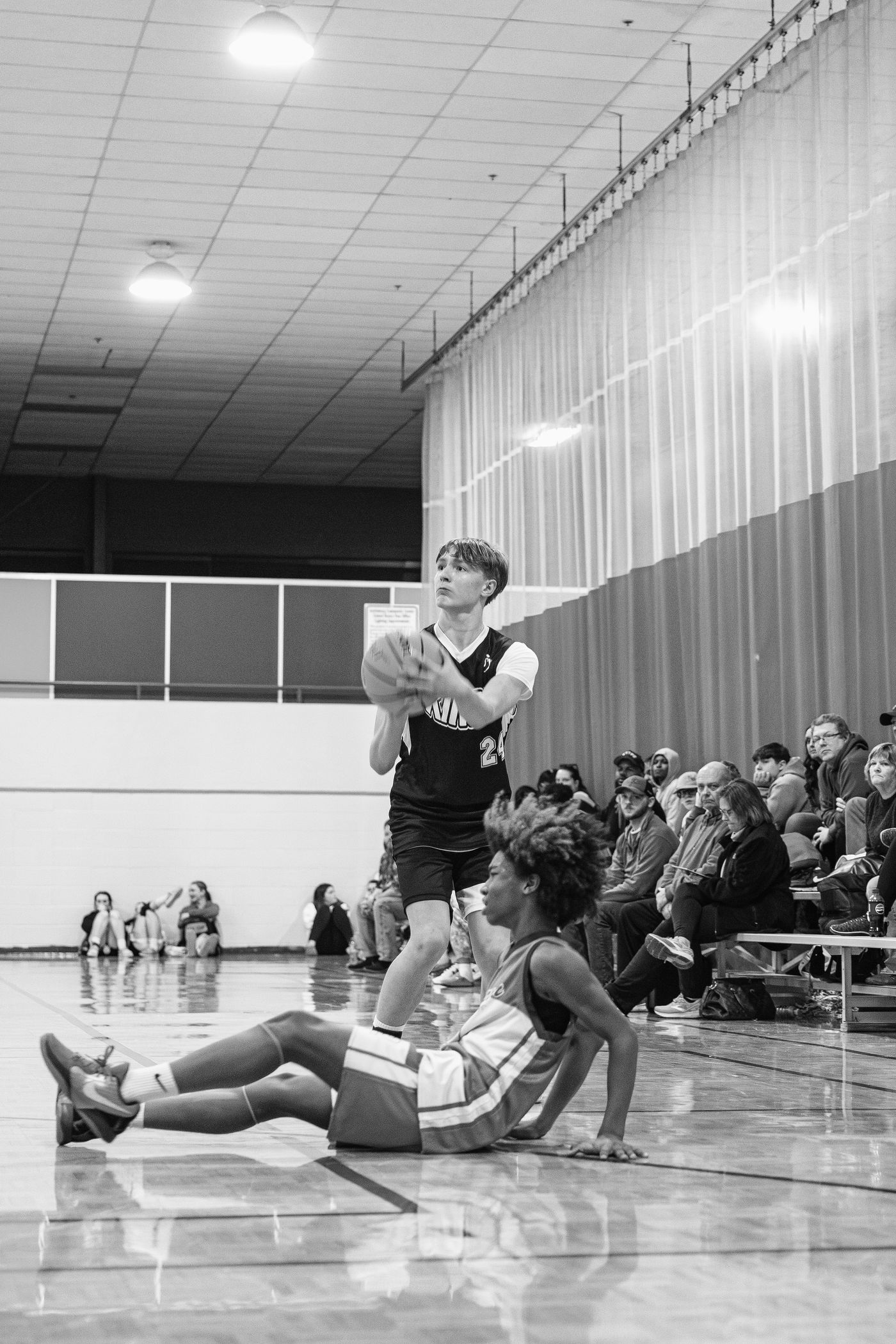 Black and white photo of a Kings player shooting a free throw.