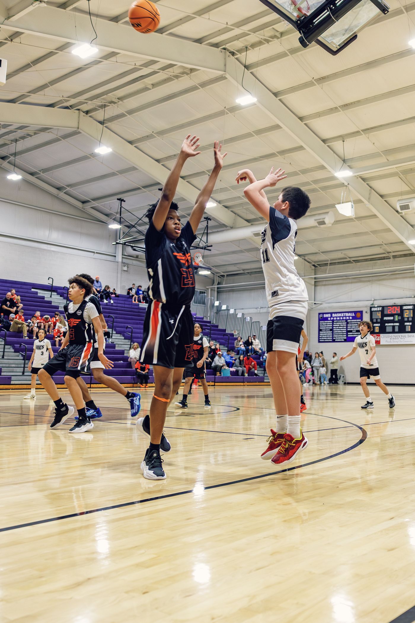 Kings player taking a jump shot against a defender.