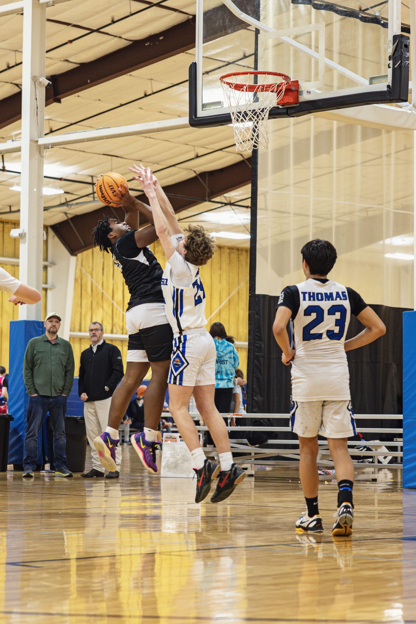 Kings player driving with the ball down the court.