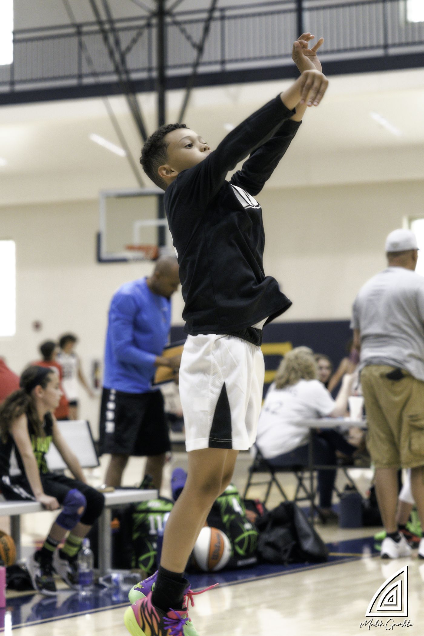 Kings player reaching for a rebound above the rim.