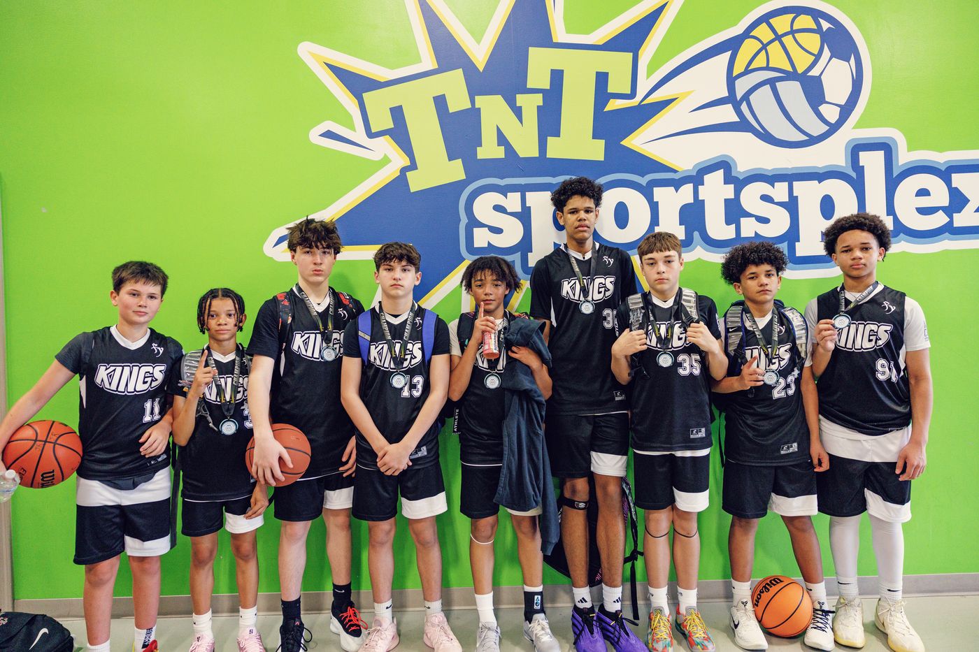 Kings 7th grade team posing together at TNT Sportsplex.
