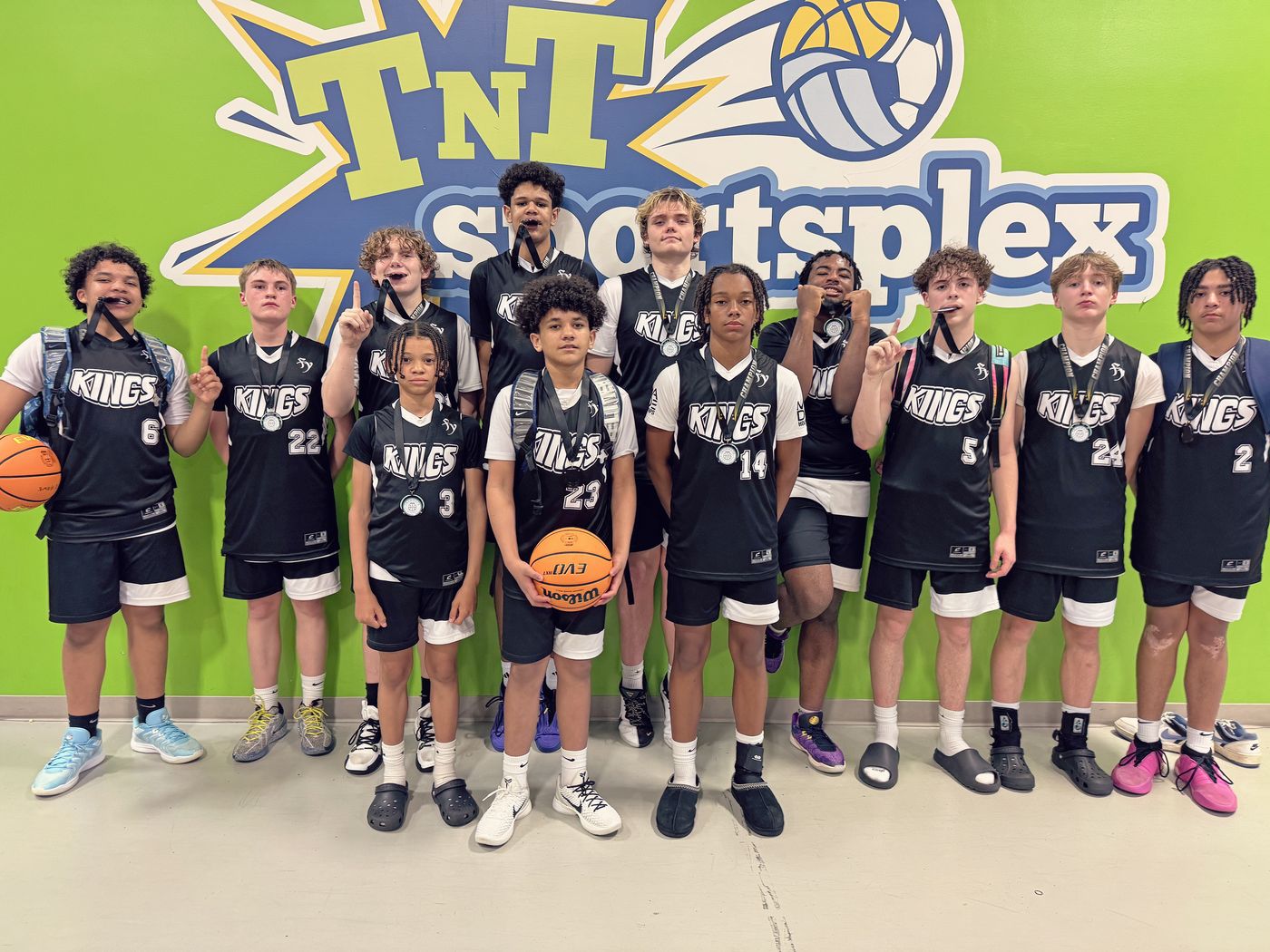 Kings 8th grade team posing together at TNT Sportsplex.